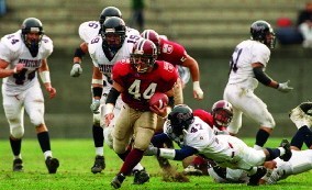 Nick Palazzo running the ball against Penn for Harvard
